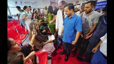 Delhi chief minister Arvind Kejriwal interacts with patients during the inauguration of the newly-built OPD Block of Aruna Asaf Ali Hospital at Civil Lines on Saturday. (HT Photo)
