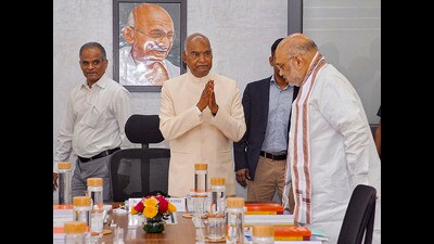 Former President Ram Nath Kovind greets Union home minister Amit Shah on Saturday. (PTI) Former President Ram Nath Kovind greets Union home minister Amit Shah on Saturday. (PTI)