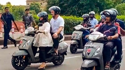 Congress leader Rahul Gandhi takes a scooty ride in Jaipur. (PTI)