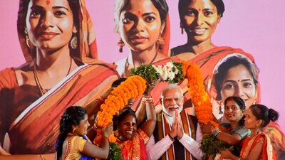 Prime Minister Narendra Modi being garlanded during an interaction with women on the Women's Reservation Bill, in Varanasi, Saturday, Sept. 23. (PTI) Prime Minister Narendra Modi being garlanded during an interaction with women on the Women's Reservation Bill, in Varanasi, Saturday, Sept. 23. (PTI)