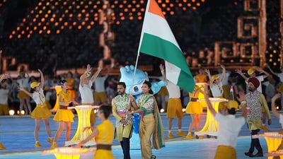 Flag-bearers Lovlina Borgohain and Harmanpreet Singh lead the Indian contingent during the opening ceremony of the 19th Asian Games at the Hangzhou Olympic Sports Centre Stadium, in Hangzhou, China (PTI)