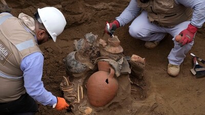 Archaeologists uncover bones and vessels discovered by city workers who were digging a natural gas line for the company Calidda in the district of Carabayllo on the outskirts of Lima, Peru, Friday, Sept. 22, 2023. Eight burial offerings from the pre-Inca Ychsma culture have been identified by archeologists so far, according to lead archeologist Jesus Bahamonde. (AP Photo/Martin Mejia) (AP) Archaeologists uncover bones and vessels discovered by city workers who were digging a natural gas line for the company Calidda in the district of Carabayllo on the outskirts of Lima, Peru, Friday, Sept. 22, 2023. Eight burial offerings from the pre-Inca Ychsma culture have been identified by archeologists so far, according to lead archeologist Jesus Bahamonde. (AP Photo/Martin Mejia) (AP)