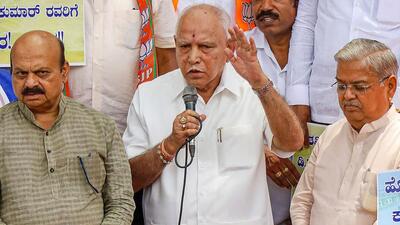 Senior BJP leaders B.S. Yediyurappa and Basavaraj Bommai during a protest against the release of Cauvery river water to Tamil Nadu from dams in Karnataka, in Bengaluru, on Saturday. (PTI)