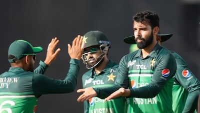 Pakistan's Shadab Khan, with out a cap, is congratulated by teammates for taking the wicket of India's Rohit Sharma during the Asia Cup (AP) Pakistan's Shadab Khan, with out a cap, is congratulated by teammates for taking the wicket of India's Rohit Sharma during the Asia Cup (AP)