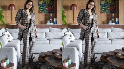 For her first look, Sonakshi wore a checked pantsuit by luxury brand Helen Anthony in shades of brown and beige. She paired it with a silver bralette for a chic look. (Instagram/@aslisona) For her first look, Sonakshi wore a checked pantsuit by luxury brand Helen Anthony in shades of brown and beige. She paired it with a silver bralette for a chic look. (Instagram/@aslisona)