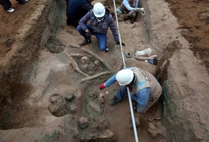 Archaeologists uncover bones and vessels discovered by city workers who were digging a natural gas line for the company Calidda in the district of Carabayllo on the outskirts of Lima, Peru, Friday, Sept. 22, 2023. Eight burial offerings from the pre-Inca Ychsma culture have been identified by archeologists so far, according to lead archeologist Jesus Bahamonde. The tube running through the site is an illegal water pipe. (AP Photo/Martin Mejia) (AP) Archaeologists uncover bones and vessels discovered by city workers who were digging a natural gas line for the company Calidda in the district of Carabayllo on the outskirts of Lima, Peru, Friday, Sept. 22, 2023. Eight burial offerings from the pre-Inca Ychsma culture have been identified by archeologists so far, according to lead archeologist Jesus Bahamonde. The tube running through the site is an illegal water pipe. (AP Photo/Martin Mejia) (AP)