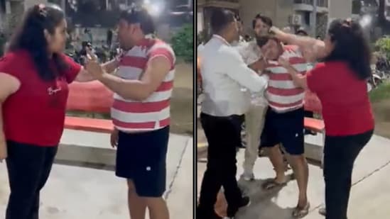 The image shows a scuffle between a man and a woman in a society in Noida. (Screengrab)
