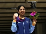 Bronze medallist Ramita poses for a photograph during the medal ceremony for the women's 10m air rifle shooting event at the 2022 Asian Games in Hangzhou in China(AFP)
