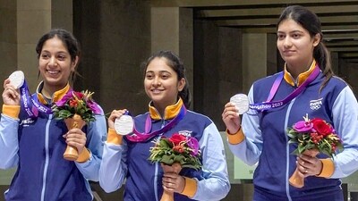 Ramita, Mehuli Ghosh and Ashi Chouksey, who opened India's medal tally, after bagging a silver medal in the women's 10m Air Rifle team event in the 19th Asian Games 2023 in Hangzhou, China, on Sunday. (Anurag Thakur Twitter) Ramita, Mehuli Ghosh and Ashi Chouksey, who opened India's medal tally, after bagging a silver medal in the women's 10m Air Rifle team event in the 19th Asian Games 2023 in Hangzhou, China, on Sunday. (Anurag Thakur Twitter)