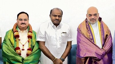 BJP president JP Nadda, JD(S) leader HD Kumaraswamy and home minister Amit Shah on Friday. (PTI) BJP president JP Nadda, JD(S) leader HD Kumaraswamy and home minister Amit Shah on Friday. (PTI)