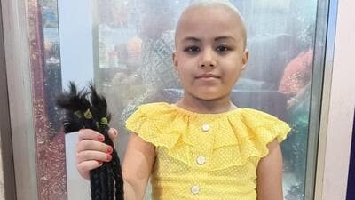 Five-year-old Anusuya Ghosh in Tripura donates her long hair for a cancer patient (HT Photo/Sourced)