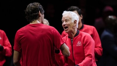 Team World captain John McEnroe, right, celebrates with Taylor Fritz, left, after Fritz defeated Team Europe's Andrey Rublev during a Laver Cup tennis singles match in Vancouver (AP) Team World captain John McEnroe, right, celebrates with Taylor Fritz, left, after Fritz defeated Team Europe's Andrey Rublev during a Laver Cup tennis singles match in Vancouver (AP)