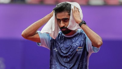 Sathiyan Gnanasekaran cools off during his team quarterfinal match against South Korea's Park Ganghyeon in men's table tennis at the 19th Asian Games in Hangzhou, China (PTI) Sathiyan Gnanasekaran cools off during his team quarterfinal match against South Korea's Park Ganghyeon in men's table tennis at the 19th Asian Games in Hangzhou, China (PTI)