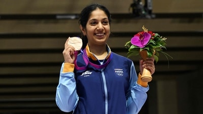 Bronze medallist Ramita poses for a photograph during the medal ceremony for the women's 10m air rifle shooting event at the 2022 Asian Games in Hangzhou in China (AFP) Bronze medallist Ramita poses for a photograph during the medal ceremony for the women's 10m air rifle shooting event at the 2022 Asian Games in Hangzhou in China (AFP)