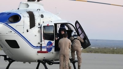 A pilot boards a helicopter before flying into the Utah desert to participate in the Osiris-Rex asteroid sample return and recovery mission at Dugway, Utah, on September 24. (AFP) A pilot boards a helicopter before flying into the Utah desert to participate in the Osiris-Rex asteroid sample return and recovery mission at Dugway, Utah, on September 24. (AFP)