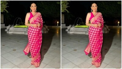 Karisma looked every bit gorgeous in the bright pink benarasi saree with intricate embroidery work in gold threads throughout the saree. In a matching sleeveless pink blouse, she completed her look. (Instagram/@therealkarismakapoor) Karisma looked every bit gorgeous in the bright pink benarasi saree with intricate embroidery work in gold threads throughout the saree. In a matching sleeveless pink blouse, she completed her look. (Instagram/@therealkarismakapoor)