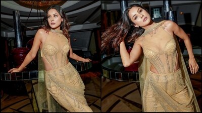 Shehnaaz Gill is currently busy promoting her upcoming film 'Thank You for Coming' and her promotional looks are simply stunning. After proving her fashion finesse at the Toronto International Film Festival, the actress made heads turn with her latest look in a golden mesh gown. With her undeniable beauty and incredible fashion sense, Shehnaaz is making her fans swoon while we can't take our eyes off her. (Instagram/@shehnaazgill) Shehnaaz Gill is currently busy promoting her upcoming film 'Thank You for Coming' and her promotional looks are simply stunning. After proving her fashion finesse at the Toronto International Film Festival, the actress made heads turn with her latest look in a golden mesh gown. With her undeniable beauty and incredible fashion sense, Shehnaaz is making her fans swoon while we can't take our eyes off her. (Instagram/@shehnaazgill)