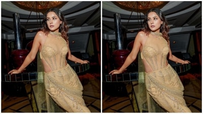 Her outfit featured a halter neck, mesh detailing at the top, corset detailing at the midriff, body con fit and intricate gold sequin work all over. The added mesh dupatta draped uniquely added an oomph factor to her look. (Instagram/@shehnaazgill) Her outfit featured a halter neck, mesh detailing at the top, corset detailing at the midriff, body con fit and intricate gold sequin work all over. The added mesh dupatta draped uniquely added an oomph factor to her look. (Instagram/@shehnaazgill)