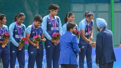 The Indian women cricket team skipper Harmanpreet Kaur along with other players with their gold medals on the podium during the post-match presentation as India Women defended 116 to beat Sri Lanka Women by 19 runs and win a gold medal Finals of Asian Games Womens T20I (IOA) The Indian women cricket team skipper Harmanpreet Kaur along with other players with their gold medals on the podium during the post-match presentation as India Women defended 116 to beat Sri Lanka Women by 19 runs and win a gold medal Finals of Asian Games Womens T20I (IOA)