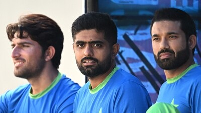 Pakistan's captain Babar Azam (C) along with teammates looks on as rain delays the Asia Cup 2023 super four one-day international (ODI) cricket match (AFP) Pakistan's captain Babar Azam (C) along with teammates looks on as rain delays the Asia Cup 2023 super four one-day international (ODI) cricket match (AFP)