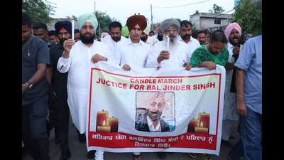 Congress leaders during a candle march in Moga on Monday. (HT photo)