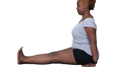 3. Dandasana: Sit upright and extend your legs in front of you. Join your legs, bringing your heels together. Maintain a straight back. Tighten your pelvic, thigh, and calves muscles. In order to support your spine, place your palms on the floor next to your hips. Also, relax your shoulders.&nbsp; (Twitter/UKIYENGARYOGA)