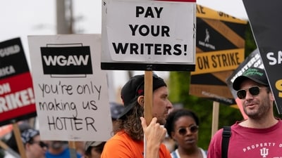 Demonstrators hold signs during a rally outside the Paramount Pictures Studio in Los Angeles, Thursday, Sept. 21, 2023. (AP) Demonstrators hold signs during a rally outside the Paramount Pictures Studio in Los Angeles, Thursday, Sept. 21, 2023. (AP)