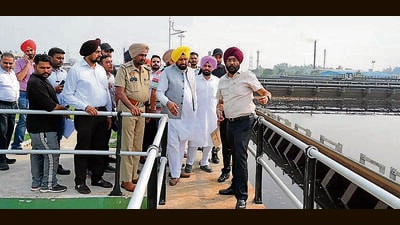Local bodies minister Balkar Singh with other officials while reviewing the ongoing  ₹650 crore project to clean Buddha Nullah in Ludhiana on Monday. (HT Photo)