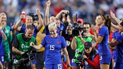United States forward Megan Rapinoe (15) is splashed with water after the game against South Africa in her last national team appearance at Soldier Field (Reuters)