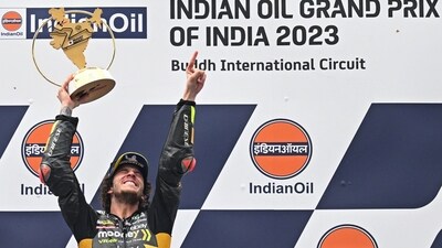 First placed Mooney VR46 Racing Team's Italian rider Marco Bezzecchi celebrates with the trophy (AFP) First placed Mooney VR46 Racing Team's Italian rider Marco Bezzecchi celebrates with the trophy (AFP)