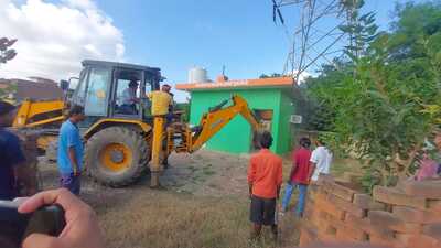 The local administration also demolished an allegedly illegal office of Bharatiya Janata Yuva Morcha that was constructed on illegally occupied land of the irrigation department. (HT)