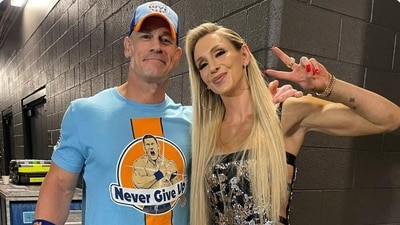 John Cena with Charlotte Flair John Cena with Charlotte Flair