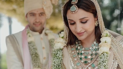 For the ceremony at The Leela Palace, Udaipur, Parineeti Chopra wore a hand-crafted lehenga designed by friend and fashion designer Manish Malhotra. The cream and champagne lehenga took 2500 hours to make and featured sequins and geometric patterns. The actor wore layered necklaces with diamonds and emeralds, which she paired with matching earrings, a maang tika, haathphool, pink chooda and gold kaleeras. For the ceremony at The Leela Palace, Udaipur, Parineeti Chopra wore a hand-crafted lehenga designed by friend and fashion designer Manish Malhotra. The cream and champagne lehenga took 2500 hours to make and featured sequins and geometric patterns. The actor wore layered necklaces with diamonds and emeralds, which she paired with matching earrings, a maang tika, haathphool, pink chooda and gold kaleeras.
