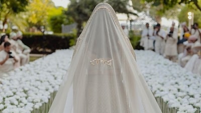 Ditching the traditional bridal bun, Parineeti Chopra went for a modern flowing hairstyle. Her hair was parted in the middle and topped with an emerald maang tikka. Her flowing hair was covered up with her long veil. In her official wedding album, there is one picture in particular that stole fans' attention. It features Parineeti's bridal veil with Raghav's name written on it. The picture was clicked as she walked down the aisle. Ditching the traditional bridal bun, Parineeti Chopra went for a modern flowing hairstyle. Her hair was parted in the middle and topped with an emerald maang tikka. Her flowing hair was covered up with her long veil. In her official wedding album, there is one picture in particular that stole fans' attention. It features Parineeti's bridal veil with Raghav's name written on it. The picture was clicked as she walked down the aisle. 