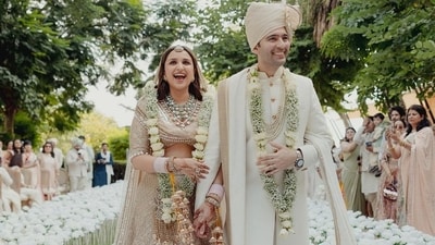 A day after their wedding, actor Parineeti Chopra and Aam Aadmi Party leader Raghav Chadha, who got engaged in May this year, took to Instagram to share some pictures from the nuptials, photographed by The House On the Clouds. One of the photos showed the newlyweds soon after the wedding ceremony. Parineeti and Raghav held hands as they walked for the first time as husband and wife. A day after their wedding, actor Parineeti Chopra and Aam Aadmi Party leader Raghav Chadha, who got engaged in May this year, took to Instagram to share some pictures from the nuptials, photographed by The House On the Clouds. One of the photos showed the newlyweds soon after the wedding ceremony. Parineeti and Raghav held hands as they walked for the first time as husband and wife.