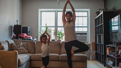 5. Vrikshasana: • Place yourself in Samasthithi. • Raise your left leg and place foot on the inside of your raised thigh. To keep your foot in position, you can support it with your palm. Join palms and lift your hands up. Do the same with the other leg.&nbsp; (Pexels)