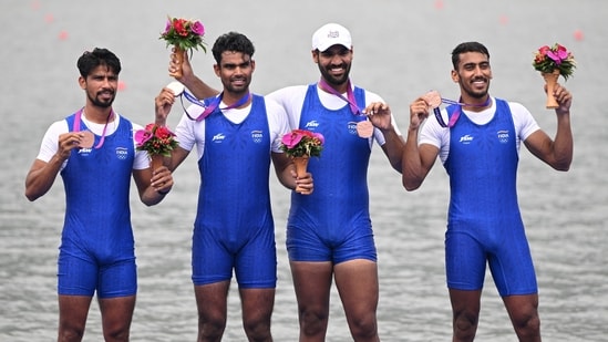 Bronze medallists Satnam Singh, Parminder Singh, Jakar Khan and Sukhmeet Singh pose during the medal ceremony for the men's quadruple sculls final event of rowing during the 2022 Asian Games in Hangzhou(AFP)