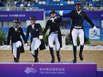 Gold medalists Sudipti Hajela, Divyakriti Singh, Vipul Chheda Hriday, Anush Agarwalla of India step on the podium during the medal ceremony of the Prix St-Georges of Equestrian Dressage team event during the Hangzhou 2022 Asian Games