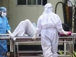 Health workers shift a man with symptoms of Nipah virus to an isolation ward at a government hospital in Kozhikode in Kerala  (AFP)