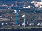 South Korea: Flags of North Korea, rear, and South Korea, front, flutter in the wind. South Korea: Flags of North Korea, rear, and South Korea, front, flutter in the wind.