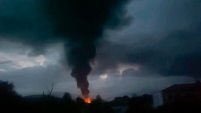 This grab taken from video distributed by Siranush Sargsyan's Twitter account on September 25 shows smoke rising after a fuel depot explosion near Stepanakert, Nagorno-Karabakh. (AP)