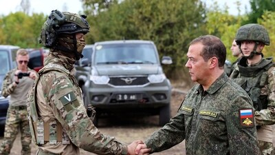 Russian Security Council Deputy Chairman and the head of the United Russia party, Dmitry Medvedev, front right, awards Russian servicemen during his visit at a military training range. (AP) Russian Security Council Deputy Chairman and the head of the United Russia party, Dmitry Medvedev, front right, awards Russian servicemen during his visit at a military training range. (AP)