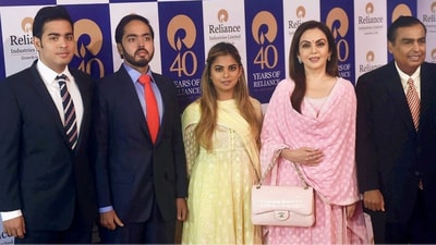 Mukesh Ambani with wife Nita Ambani and children. (PTI) Mukesh Ambani with wife Nita Ambani and children. (PTI)
