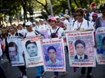 Demonstrators hold a protest to mark the 9th anniversary of the 43 Ayotzinapa Teacher Training College's students' disappearance, in Mexico City, Mexico September 26.