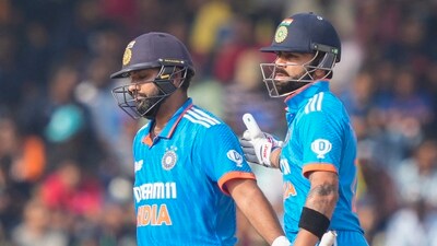 India's Rohit Sharma, left, is congratulated by Virat Kohli for scoring a half century during the Asia Cup (AP)