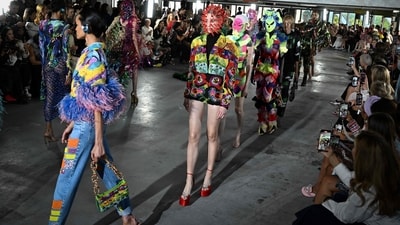 Models present Germanier creations at Paris Fashion Week Spring/Summer 2024. His dazzling collection managed to combine his high-octane, full-colour beaded designs with a smart range of blazers, spencers and jackets. (Photo by Miguel MEDINA / AFP) Models present Germanier creations at Paris Fashion Week Spring/Summer 2024. His dazzling collection managed to combine his high-octane, full-colour beaded designs with a smart range of blazers, spencers and jackets. (Photo by Miguel MEDINA / AFP)