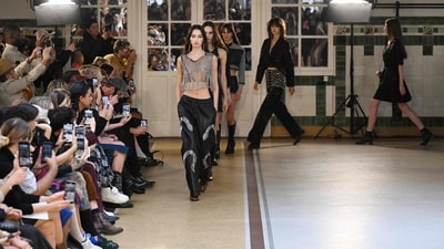 Models presented Victoria/Tomas creations during a show at Paris Fashion Week Womenswear Spring/Summer 2024. With tassels, pantsuits and loose-fitting trousers, her designs are full of edgy styles that exclude boss babe vibes. (Photo by Bertrand GUAY / AFP) Models presented Victoria/Tomas creations during a show at Paris Fashion Week Womenswear Spring/Summer 2024. With tassels, pantsuits and loose-fitting trousers, her designs are full of edgy styles that exclude boss babe vibes. (Photo by Bertrand GUAY / AFP)