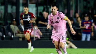 Inter Miami's Argentine forward #10 Lionel Messi runs with the ball during the Major League Soccer (MLS) football match between Inter Miami CF and Toronto FC (AFP)