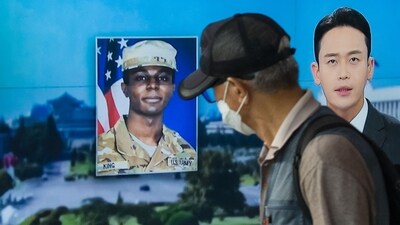 A man walks past a television showing a news broadcast featuring a photo of US soldier Travis King (C), who ran across the border into North Korea while part of a tour group visiting the Demilitarized Zone on South Korea's border. (AFP) A man walks past a television showing a news broadcast featuring a photo of US soldier Travis King (C), who ran across the border into North Korea while part of a tour group visiting the Demilitarized Zone on South Korea's border. (AFP)