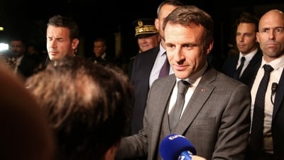 French President Emmanuel Macron meets local residents in Ajaccio, on the French Mediterranean island of Corsica, on September 27, 2023 as he arrives for a three days visit. (Photo by Pascal POCHARD-CASABIANCA / AFP) (AFP)